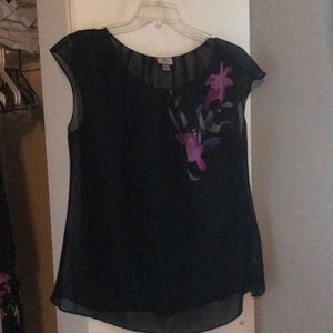 Sleeveless blouse flower left shoulder/chest.